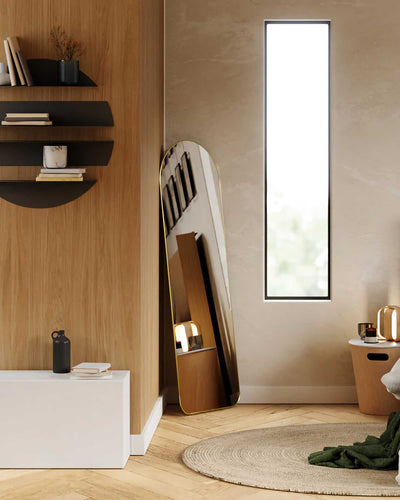 Umbra Hubba arched leaning mirror, brass