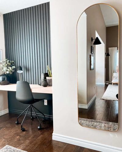 Umbra Hubba arched leaning mirror, brass