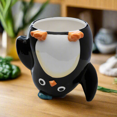 Huddle Penguin upside down ceramic mug